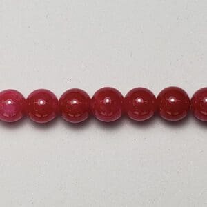 Row of red gemstone beads.