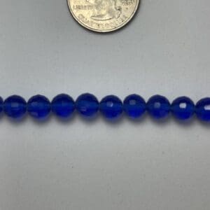 Row of cobalt blue glass beads.