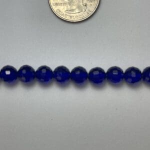 Row of cobalt blue glass beads.