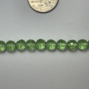 Light green glass beads close-up.