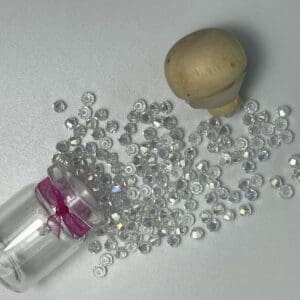 Clear glass beads spilled from jar.