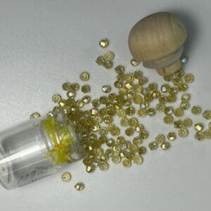 Small jar tipped with yellow crystal beads