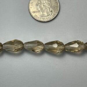 Smoky quartz faceted beads, size comparison.