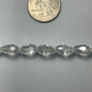 Clear glass beads, size comparison.