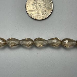 Light brown faceted glass beads.