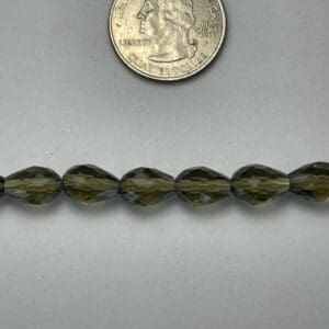 Dark green faceted glass beads.