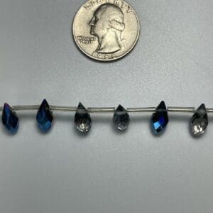 Dark blue teardrop crystal beads.