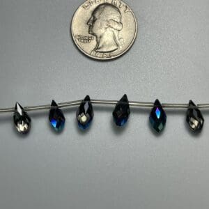 Dark blue teardrop crystal beads.