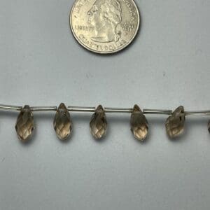 Smoky quartz faceted pear beads.