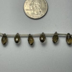 Smoky quartz faceted teardrop beads.
