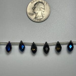 Dark teardrop crystals size comparison.