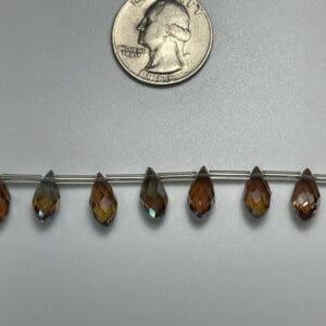 Amber teardrop crystals, size comparison.