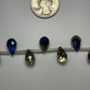 Dark blue and green teardrop beads.
