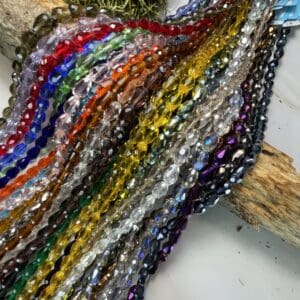 Colorful crystal beads on display with wood.