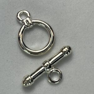 Silver toggle clasp on white background.