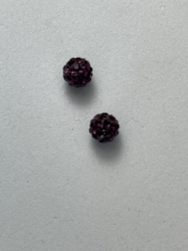 Pair of purple rhinestone earrings.