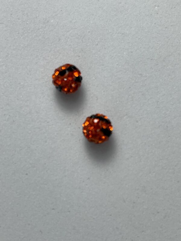 Orange and black rhinestone beads.