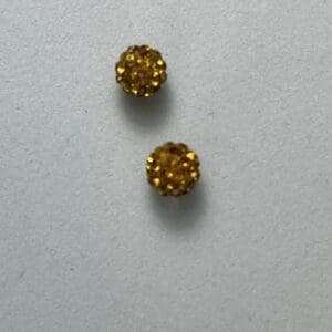 Two small round yellow textured objects.