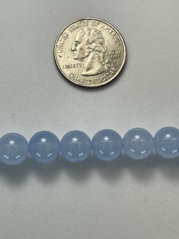 Light blue chalcedony beads with quarter.