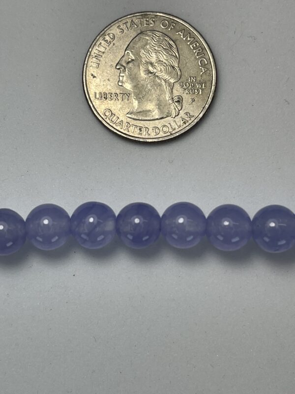 Lavender beads with quarter for scale.