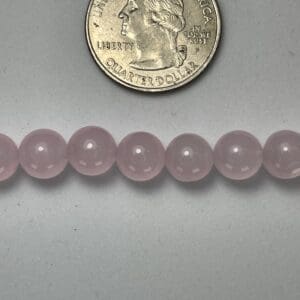 Pink rose quartz beads size comparison.